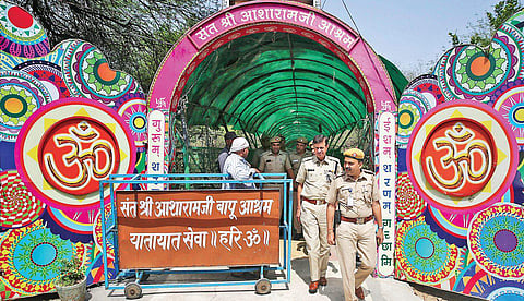 Policemen at the main entrance of Asaram Bapu ashram. | Shekhar Yadav