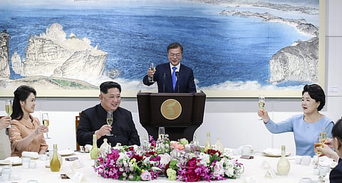 South Korean President Moon Jae-in, top center, his wife Kim Jung-sook, right, North Korean leader Kim Jong Un, second left, his wife Ri Sol Ju, left, attend at a banquet at the border village of Panmunjom in the Demilitarized Zone, South Korea, Friday, A