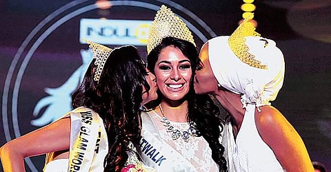 Estefania Garcia of Mexico, the winner of Indulge Miss Glam World, being congratulated by  Fahima Kulow from Kenya, the first runner-up, and Aileena Catherin, of India, second runner-up  | Albin mathew