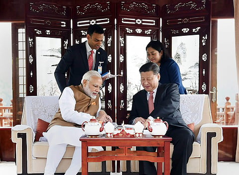 Prime Minister Narendra Modi with Chinese President Xi Jinping inside a house boat in Wuhan s East Lake China on Saturday. | PTI