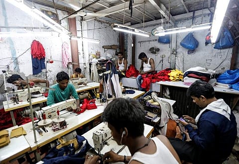 Employees work inside a garment factory in Mumbai. (Photo | Reuters)