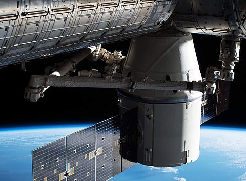In this image provided by NASA, the Dragon capsule arrives at the International Space Station on Wednesday, April 4, 2018 with food and experiments. It will remain attached to the orbiting outpost for about a month, returning to Earth in May. (Photo | AP)