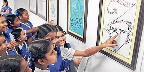 Students at the calligraphy exhibition at Cultural Centre of Vijayawada and Amaravati on Wednesday | P Ravindra Babu