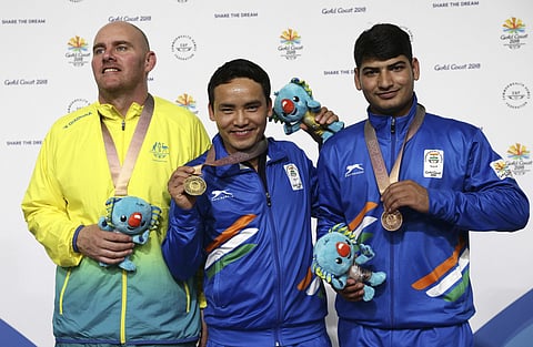Jitu Rai started the gold rush today in the 10m air pistol event, shrugging off a weak qualifying round to shatter the Games record with a score of 235.1 in the final.The 17-year-old Mehuli Ghosh grabbed a silver in the 10m air rifle, finishing ahead of experienced teammate Apurvi Chandela. (Photo | AP)