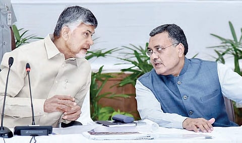 Chief Minister N Chandrababu Naidu having a word with Chief Secretary Dinesh Kumar at the Collectors’ Conference in Undavalli on Wednesday | Express
