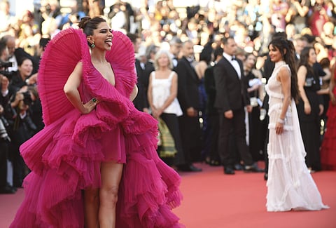 deepika padukone cannes 2018 pink dress Throwback to Deepika Padukone lighting up Cannes 2018 in this dramatic red ruffle gown. Bold, sculptural, and effortlessly Bollywood royalty. #starbvibeex#ThrowbackThursday #DeepikaPadukone Cannes2018 BollywoodFashion RedCarpetStyle IndianCelebrities