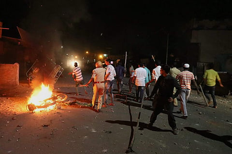 Rioters hurl stones and sticks during a communal riot that escalated due to clamping illegal water connection in a religious place in Moti Karanja area of Aurangabad on Friday, 11 May, 2018 | PTI