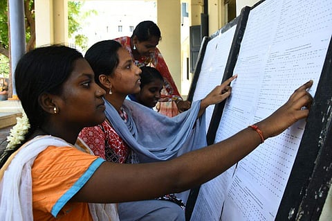 Students check their 12th exam results at Lady sivasamy school in Mylapore on Wednesday. (EPS | Ashwin Prasath)