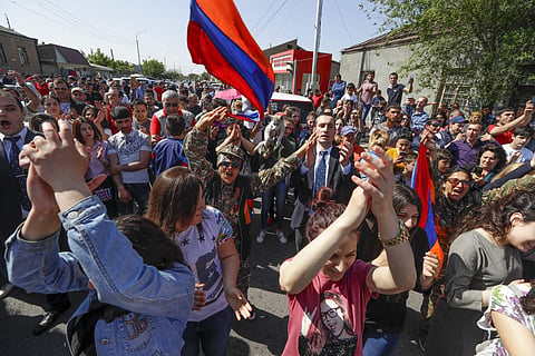 Supporters of the opposition lawmaker Nikol Pashinian dance and sing as they block a road to the airport just outside Yerevan, Armenia, Wednesday, May 2, 2018. (Photo | AP)