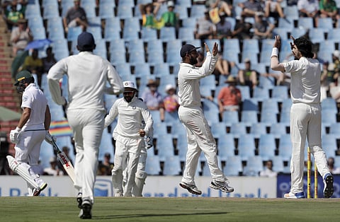 India's bowler Ishant Sharma, far right, celebrates with teammates after bowling South Africa's batsman AB de Villiers, far left, for 20 runs on the first day of the second cricket test match between South Africa and India at Centurion Park in Pretoria, S
