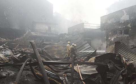 Fire officials trying to control fire in a rubber factory at Malviya Nagar area in New Delhi on Wednesday. (Shekhar Yadav | EPS)