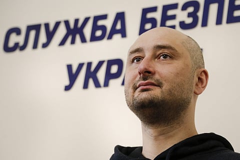 Russian journalist Arkady Babchenko, listens for a question during a news conference with Vasily Gritsak, head of the Ukrainian Security Service and Ukrainian Prosecutor General Yuriy Lutsenko at the Ukrainian Security Service on Wednesday, May 30, 2018. 