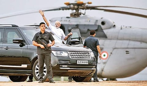 Prime Minister Narendra Modi waves at the crowd as he leaves after addressing a rally in Kengeri in Bengaluru, on Thursday | vinod kumar t