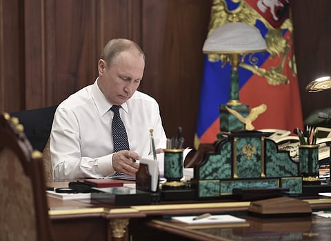 Vladimir Putin sits in his Kremlin cabinet prior his inauguration ceremony as new Russia's president in Moscow, Russia, Monday, May 7, 2018. (AP)