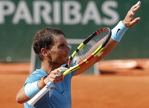 Spain's Rafael Nadal waves after defeating Argentina's Guido Pella during their second round match of the French Open | AP