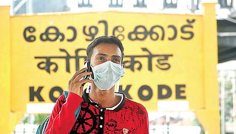 In the wake of the Nipah virus outbreak, travellers from neighbouring districts take precautionary measures such as protective masks, while journeying to Kozhikode | T P Sooraj