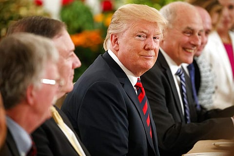 President Donald Trump listens during a meeting with Singapore Prime Minister Lee Hsien Loong ahead of a summit with North Korean leader Kim Jong Un. | AP