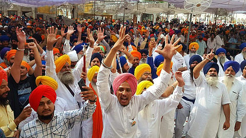 A crowd gathered at the Akal Takht in the Golden Temple complex.