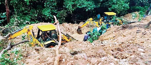 Excavators being used to clear debris on Charmadi Ghat on Tuesday  | express