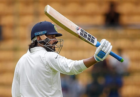 India's Murali Vijay celebrates his fifty runs on the first day of the one-off Test match against Afghanistan at Chinnaswamy Stadium in Bengaluru on Thursday June 14 2018. | PTI