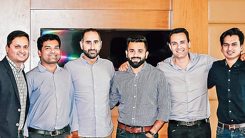 Truecaller chief strategy officer Nami Zarringhalam (third from left) and  co-founder Alan Mamedi (second from right) pose with Chillr co-founders (from left) Sony Joy, Anoop Sankar, Lishoy Bhaskaran and Mohammed Galib