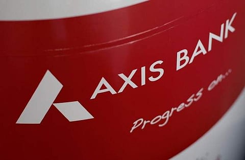 The logo of Axis Bank is seen on an advertisement at its branch in Mumbai, India (File Photo | Reuters)