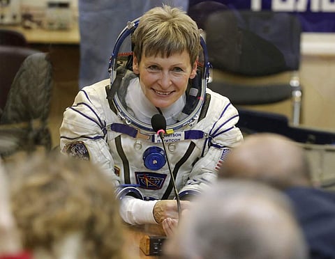 In this Nov. 17, 2016 file photo, U.S. astronaut Peggy Whitson, member of the main crew of the expedition to the International Space Station (ISS), speaks with her relatives prior the launch of Soyuz MS-3 space ship at the Russian leased Baikonur cosmodro