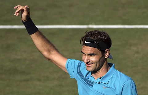 Roger Federer celebrates winning the semifinal tennis match against Nick Kyrgios during the ATP Mercedes Cup in Stuttgart. | AP