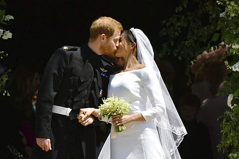In this Saturday, May 19, 2018 file photo, Britain's Prince Harry and Meghan Markle leave after their wedding ceremony at St. George's Chapel in Windsor Castle in Windsor, near London, England. | AP