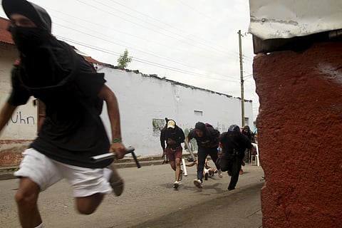 Anti-government protesters are forced away in Nicaragua. (File | AP)
