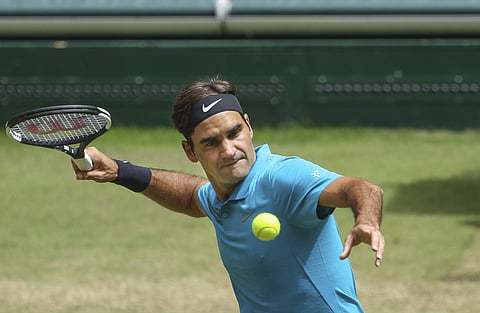 Roger Federer returns the ball to Denis Kudla during their semi final match at the Gerry Weber Open ATP tennis tournament in Halle. 