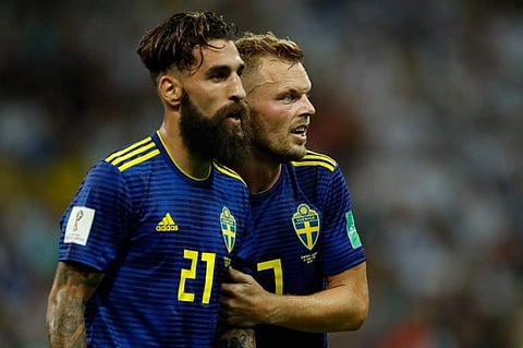 Sweden's midfielder Jimmy Durmaz (L) | AP