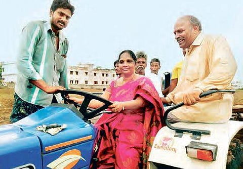 Joint Director of Agriculture M Vijaya Bharati drives a tractor to kick-start the Eruvaka festival at Ganapavaram village in Guntur district on Thursday | EXPRESS