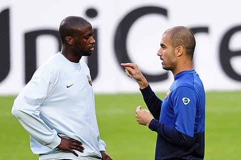 Yaya Toure with Pep Guardiola (File photo | AP)