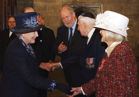 Britain's Queen Elizabeth II meets Holocaust survivor Gena Turgel during a service to remember victims of the Holocaust in Westminster Central Hall in London. | AP