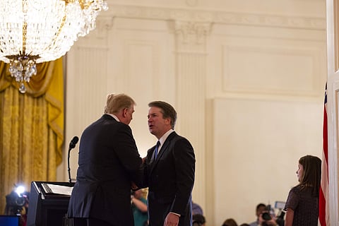 President Donald Trump shakes hands with Brett Kavanaugh, his Supreme Court nominee, in the East Room of the White House, Monday, July 9, 2018, in Washington. (Photo: AP)