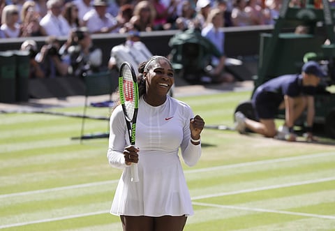 Serena Williams of the United States celebrates winning her women's singles quarterfinals match against Italy's Camila Giorgi, at the Wimbledon Tennis Championships, in London. 