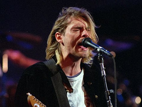 Kurt Cobain of the Seattle band Nirvana performing in Seattle, Wash. | AP Photo/Robert Sorbo, File