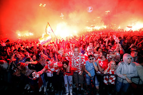 Croatian fans cheer while watching the semifinal match between Croatia and England at the 2018 soccer World Cup, in Zagreb, Croatia, Wednesday, July 11, 2018. | AP
