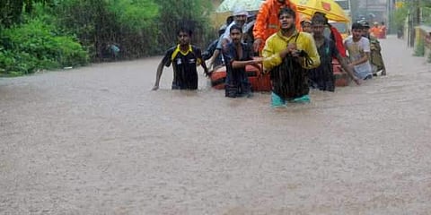 Fire personnel rescue school children and public at Aleke. (File | EPS)