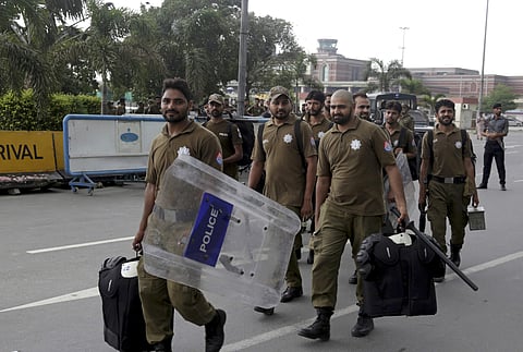Pakistani police officers are deployed at Lahore airport in Pakistan. ( Photo | AP)