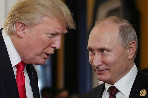 In this file photo taken on November 11, 2017 US President Donald Trump (L) chats with Russia's President Vladimir Putin. (File | AFP)