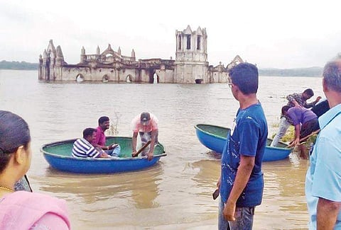 Visitors take coracles to Shettihalli Mariyamma Church | (Photo | EPS)