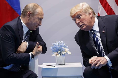 US President Donald Trump with Russian President Vladimir Putin at the G-20 Summit in Hamburg, Germany. (Photo | AP)