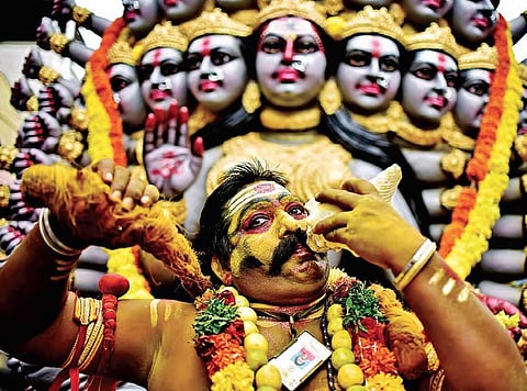 A potharaju performs during ‘Bonalu’ at Golconda, in Hyderabad on Sunday   | vinay madapu