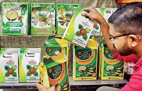 A shopkeeper arranging packets of various brands of Karkidaka kanji at a shop in the capital on Monday in view of Karkidakam month starting on Tuesday  B P Deepu