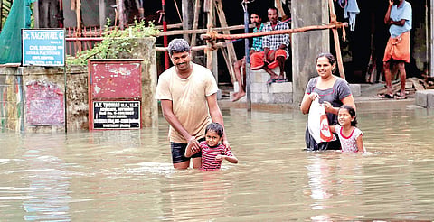 A family moves to safer place after their area was inundated in heavy rain. A scene from Chavittuvari near Kottayam | Express