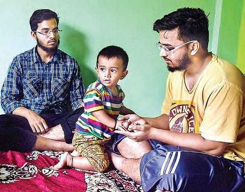 Twin brothers Mohammed Aslam and Mohammed Akram take turns to engage their elder brother Azam’s 18-month-old  son, who asks for his father the first thing in the morning | vinay madapu
