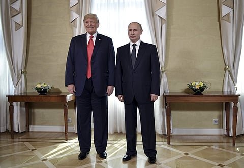 US President Donald Trump and Russian President Vladimir Putin, right, pose for a photograph at the Presidential Palace in Helsinki, Finland. (Photo | AP)
