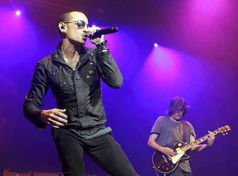 In this May 16, 2015, file photo, Chester Bennington, left, performs with Linkin Park. (AP)